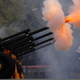 Royal guards fire a series of cannon salutes during the coronation.